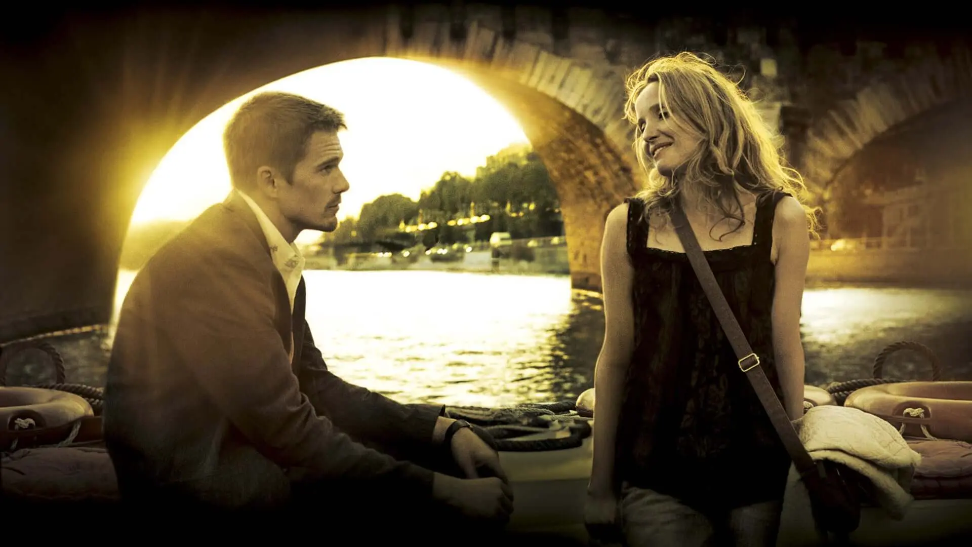 Two lovers enjoy a conversation on a boat in Paris.