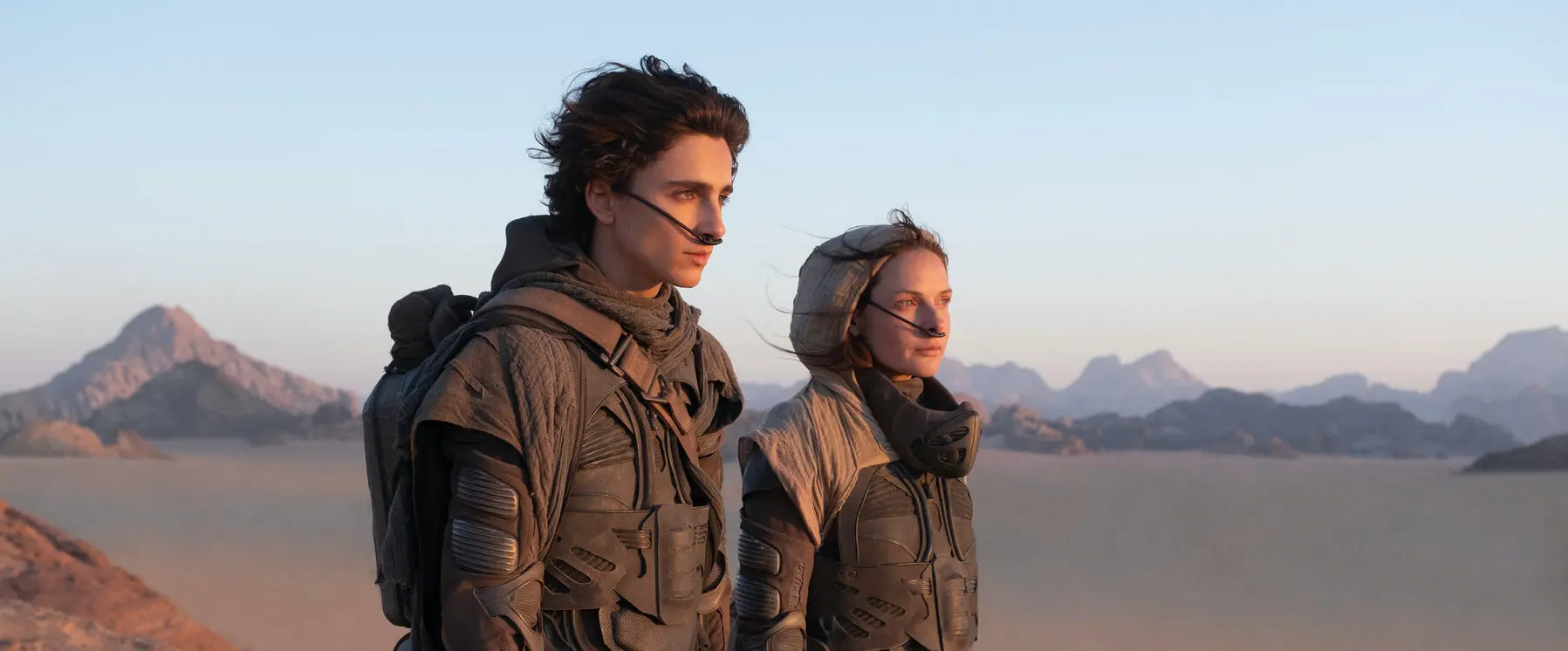 Paul Atreides (Timothée Chalamet) and Lady Jessica (Rebecca Ferguson) observe the desert.