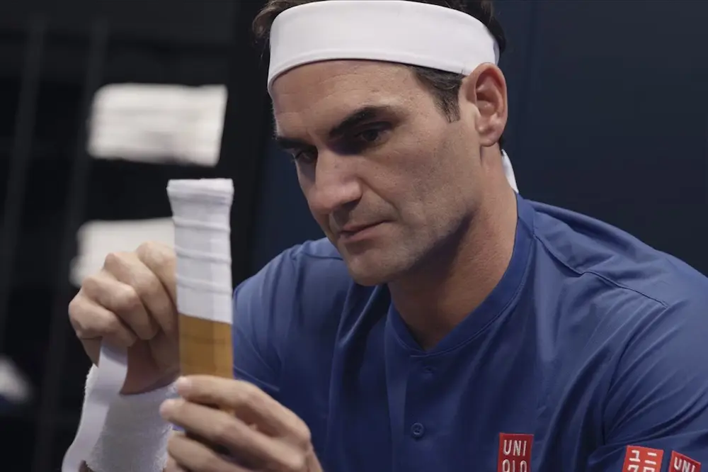 Roger Federer, a professional tennis player, strings his racket for a match one last time.