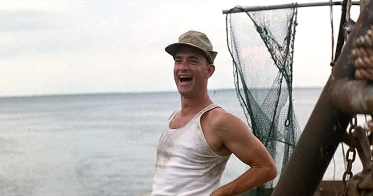 Forrest Gump (Tom Hanks) waves to his friend.