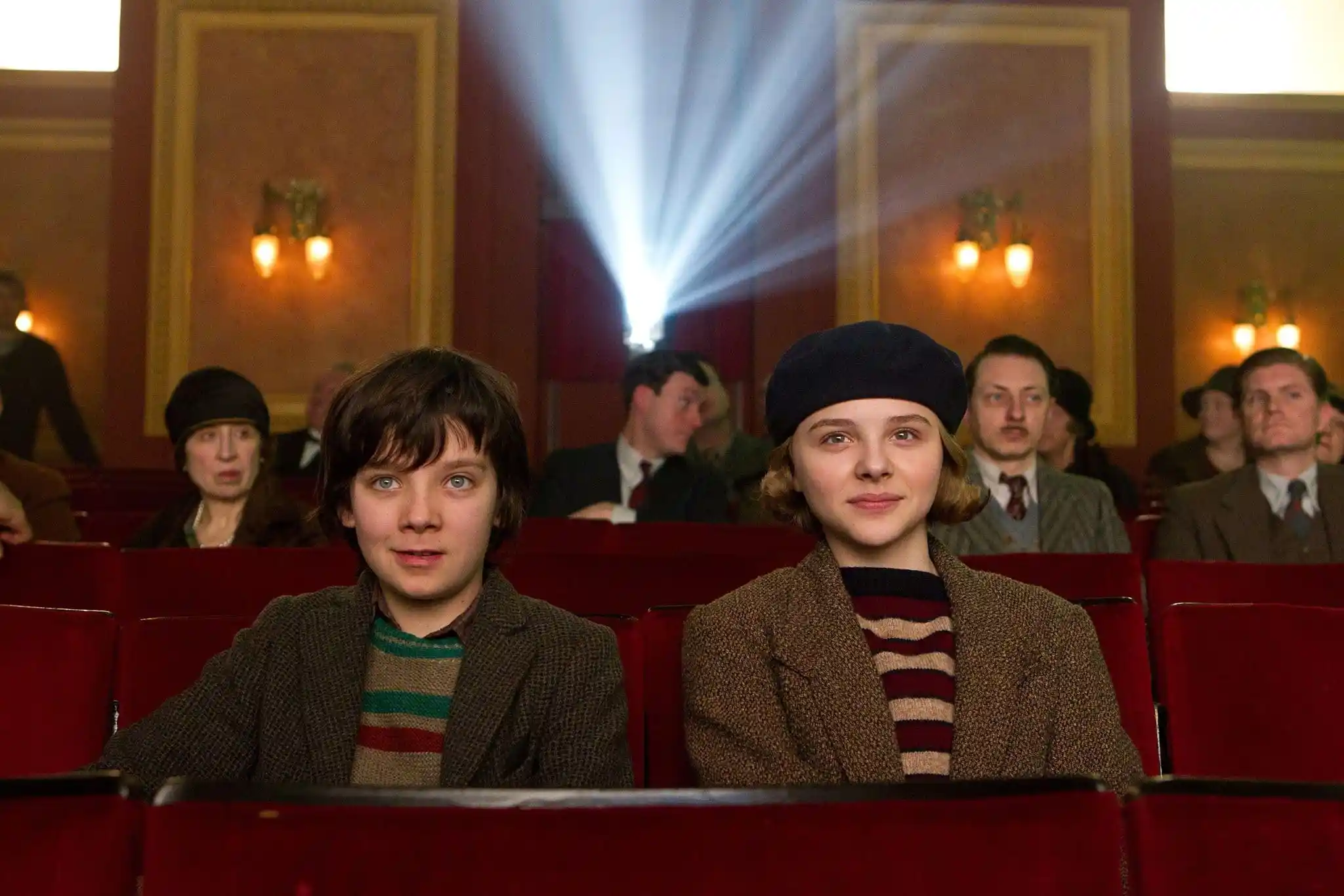 Hugo (Asa Butterfield) and Isabel (Chloë Grace Moretz) watch a movie!