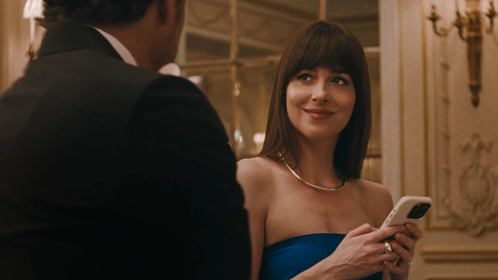 Link to Materialists movie review Dakota Johnson, Pedro Pascal, and Chris Evans play characters in a love triangle.
