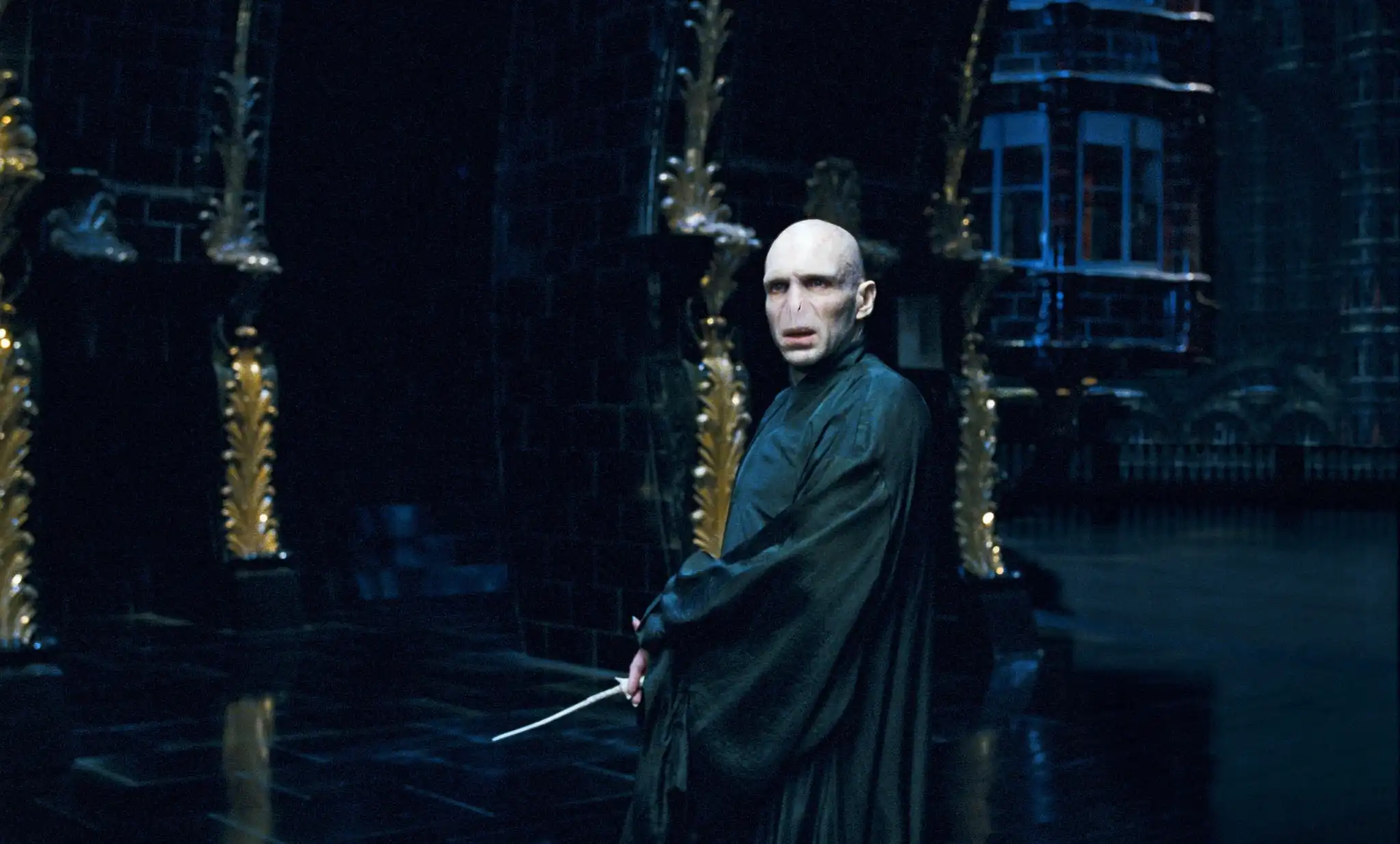 Voldemort (Ralph Fiennes) looks menacing in a dark cloak.