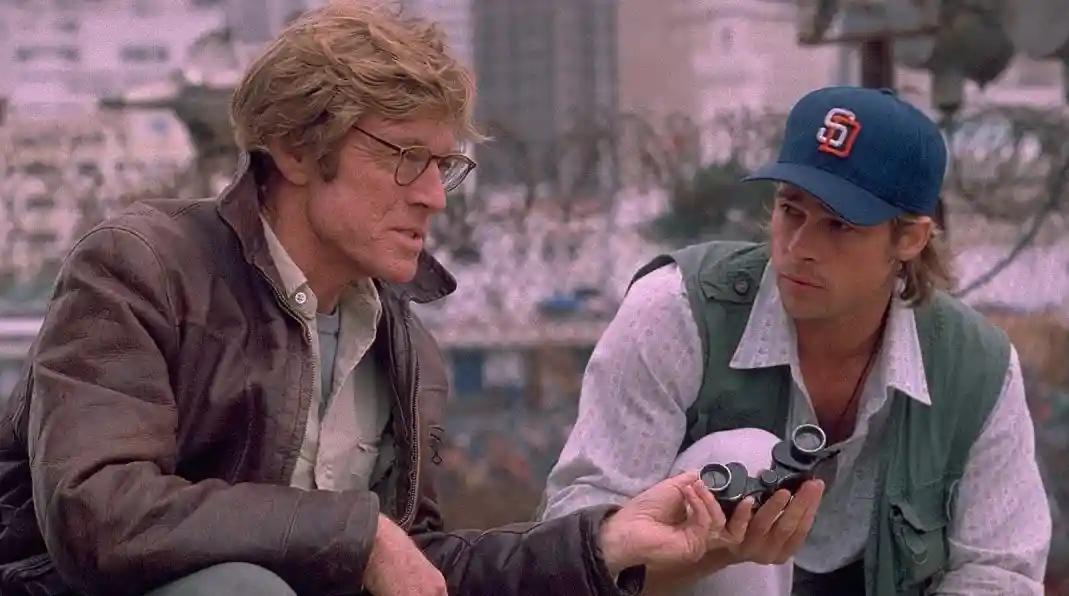 Robert Redford and Brad Pitt star as intelligence expert and spy protegé.