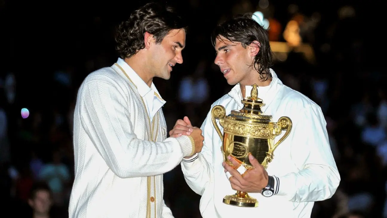 Roger Federer and Rafael Nadal shake hands at the end of Wimbledon 2008.